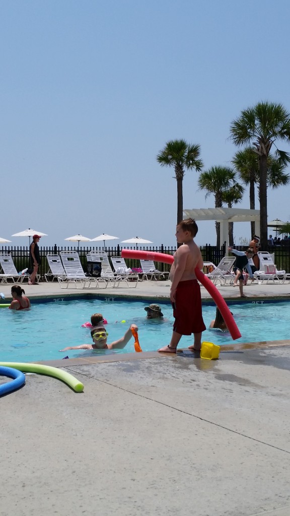 The boys at the pool. (CJ is in the water.)