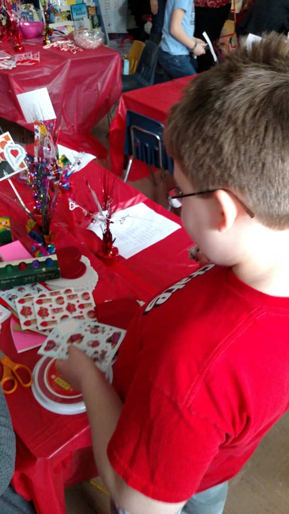 CJ working on Valentine's Day crafts